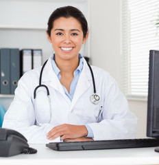 Beautiful woman doctor with a stethoscope posing