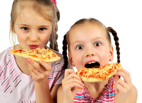 little girls eating pizza