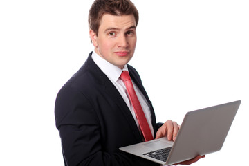 Business man with a laptop isolated over white