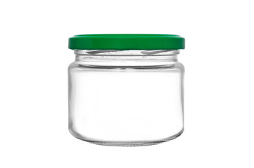 Empty glass jar with green cover isolated on white background
