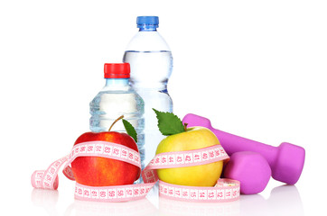 towel, apple with measure tape, dumbbells and water bottle isola
