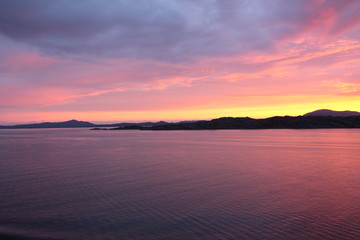 sunset view from a boat off the coast of norway