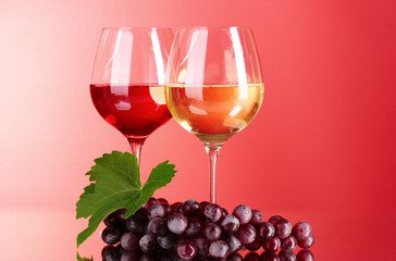 Wine bottle and glass on red background