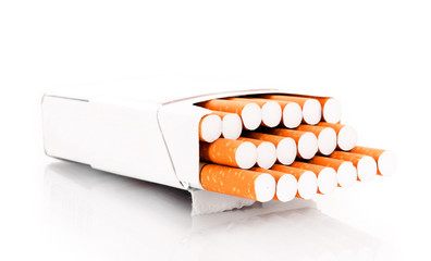 Many cigarettes in box isolated on white
