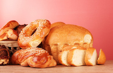 Baked bread assortment on red background
