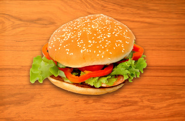 Fresh cheeseburger on wood background