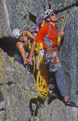 Team of climbers reaching the summit.