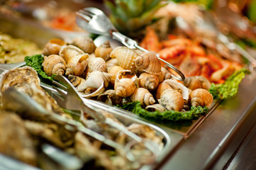 raw frog legs on buffet