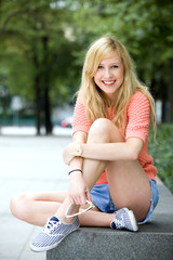 Young woman sitting outdoors