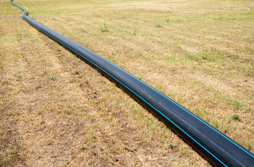 Pvc pipeline at meadow