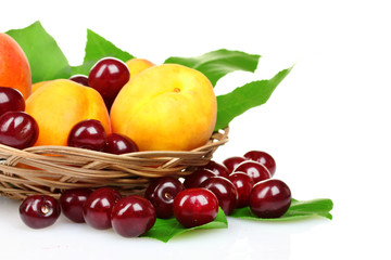 Naklejka na ściany i meble beautiful apricot, cherry and apple in a basket