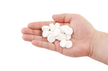 Tablets on hand isolated on white