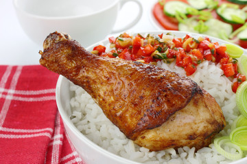 Fried chicken leg with rice and vegetables