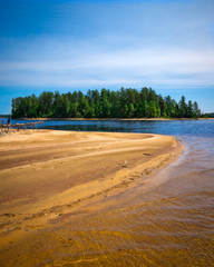 Sandy Beach with Treed Island in Background