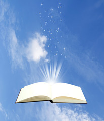 Open book magic on sky background - Education concept