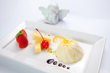 Cream caramel dessert with strawberries