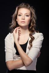 Naklejka premium Portrait of beautiful female on black background