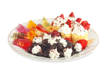 Sweet pancakes with strawberry, cherry, jelly and prunes