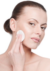 Young beautiful woman with clean sponge