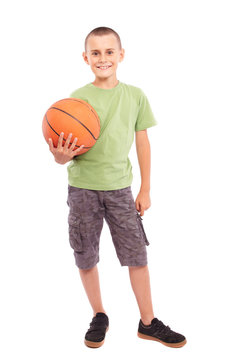 Child with basketball isolated on white background