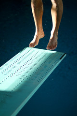 feet jumping on springboard - 34089924