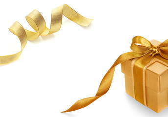 Gold gift box on white  background with Shiny gold satin ribbon