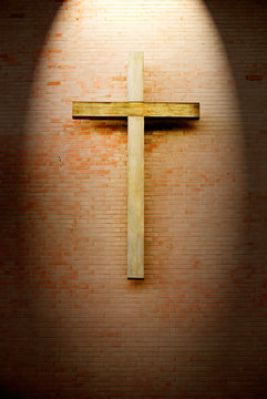 Wooden Crucifix On The Brick Wall