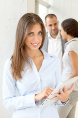 Fototapeta premium Young woman using electronic tablet in meeting
