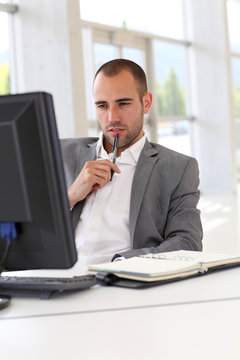 Portrait of concentrated businessman at work