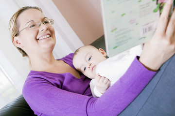 Fototapeta premium Mother and baby boy to read