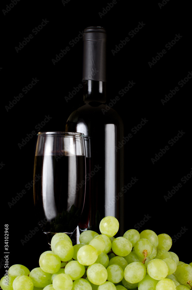 Wall mural red wine glass on a black