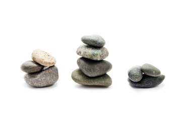 A few stones of different sizes, isolated on white.