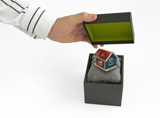 Gift box with house inside