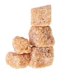 Some brown lump cane sugar cubes, isolated on white