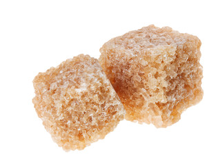 Two brown lump cane sugar cubes, isolated on white