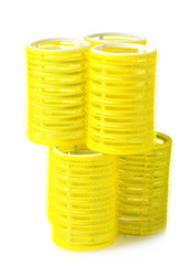 Yellow hair curlers isolated on white