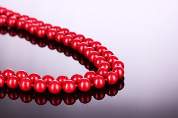 red pearls on black background