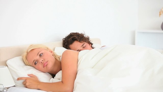Waking woman while husband sleeping