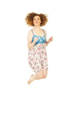 Happy redhead woman jumping