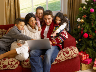 Hispanic family Christmas shopping online