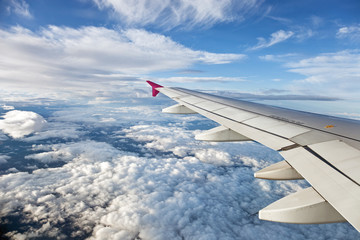 Fototapeta premium Clouds and plane wings