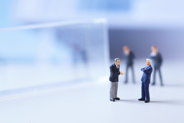 Miniature figurines of successful business team.