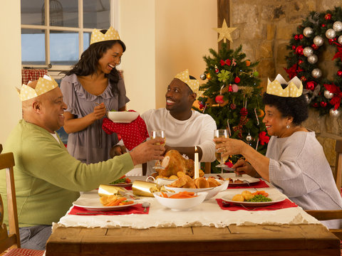 Adult African American Family Having Christmas Dinner