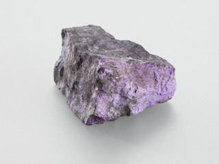 Sugilit mineral on grey background