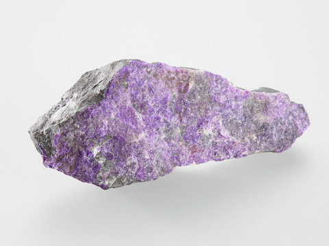 Mineral Sugilit on grey background