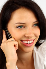 Young woman on the phone - isolated on white