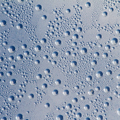 Water drops on a grey-blue background