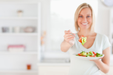 Obraz na płótnie Canvas Woman offering salad