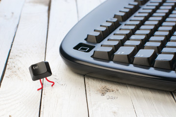 Escape key run away from a black keyboard