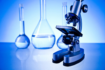 microscope and laboratory glassware